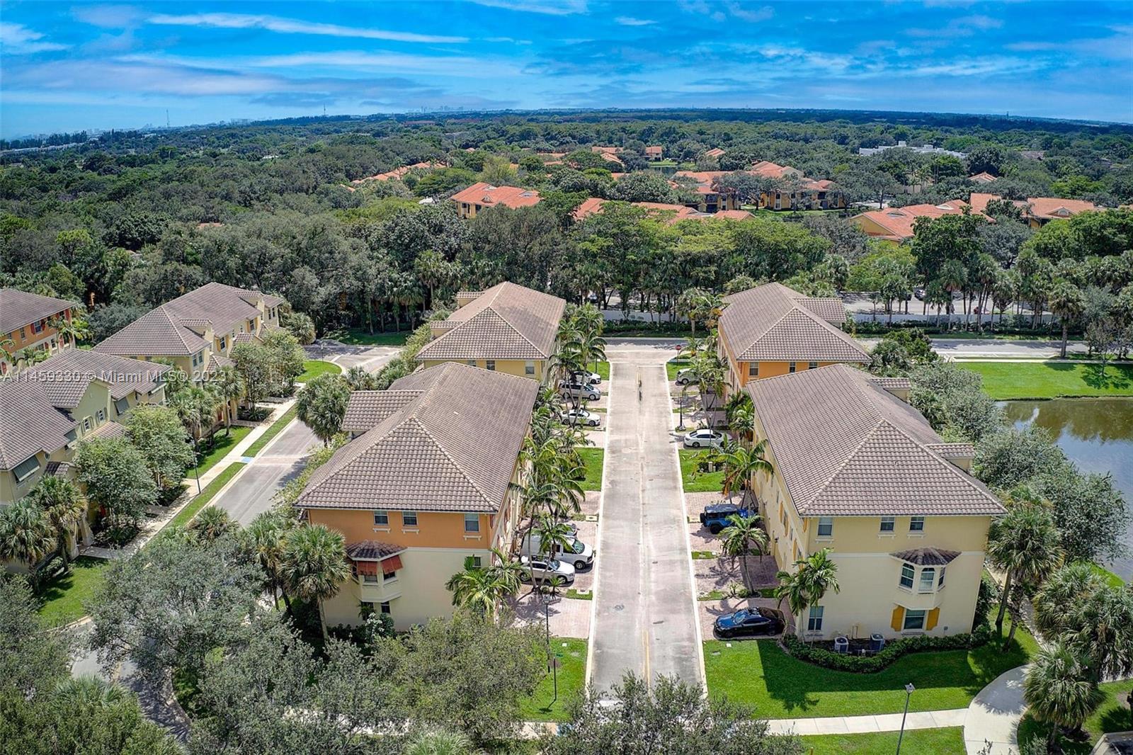 3920 Passion Flower Road Coconut Creek, FL 33073 - Photo 33 of 37 an aerial view of multiple house