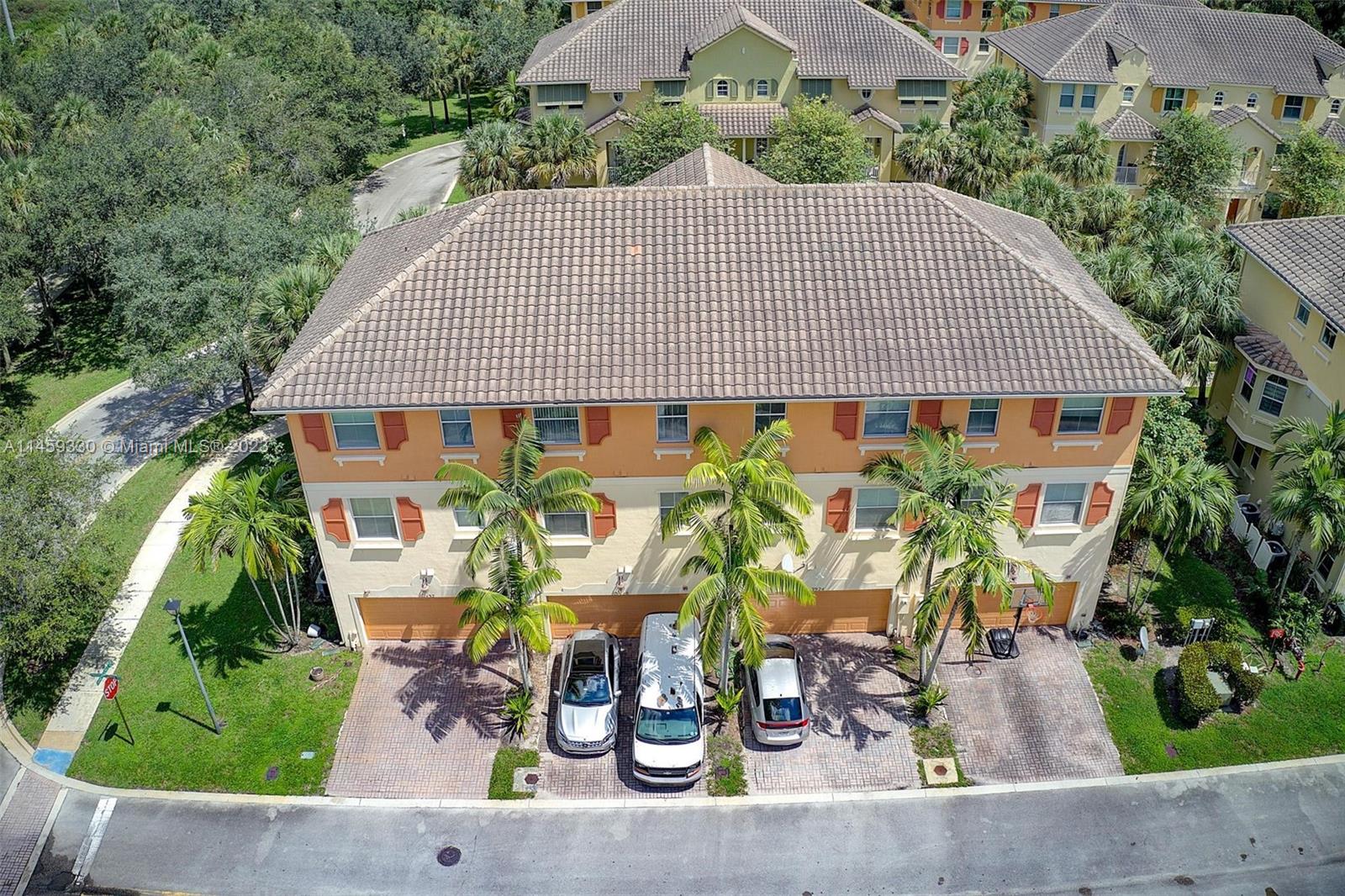 3920 Passion Flower Road Coconut Creek, FL 33073 - Photo 35 of 37 an aerial view of a house with garden and plants