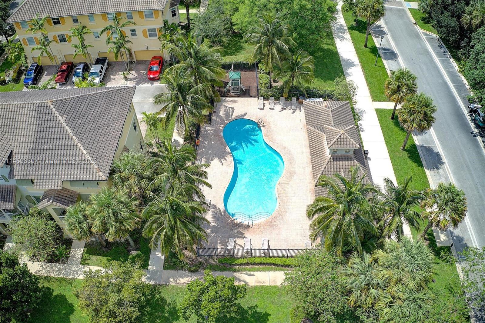 3920 Passion Flower Road Coconut Creek, FL 33073 - Photo 37 of 37 an aerial view of a house with outdoor space and trees all around