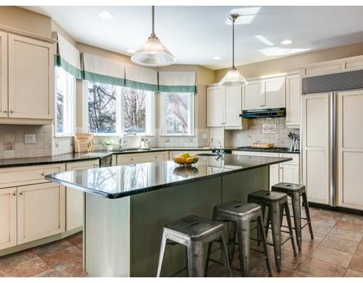 65 Old Farm Road Newton, MA 02459 - Photo 7 of 30 a kitchen with stainless steel appliances granite countertop a sink a stove a refrigerator a center island and cabinets