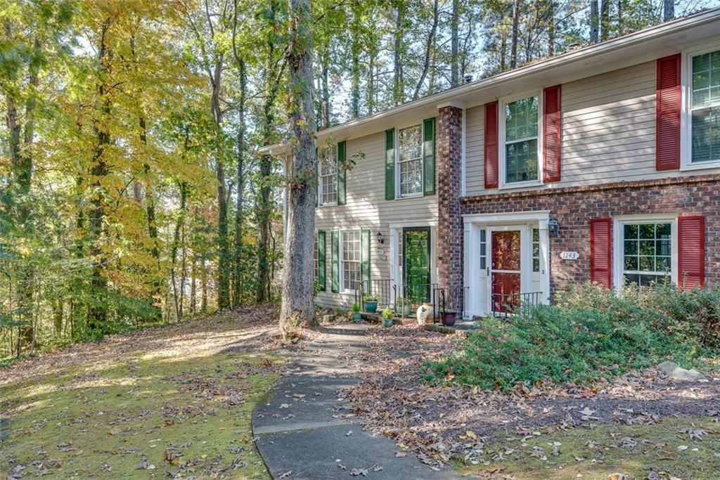 1145 Kingstown Court Decatur, GA 30033 - Photo 1 of 1 a front view of a house with garden