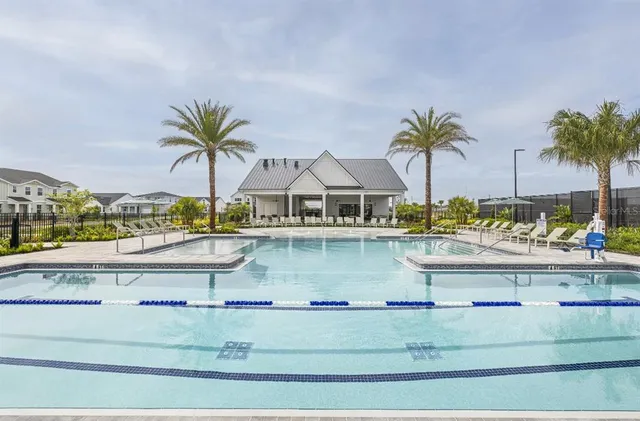 a view of a dining room with furniture a chandelier and pool table