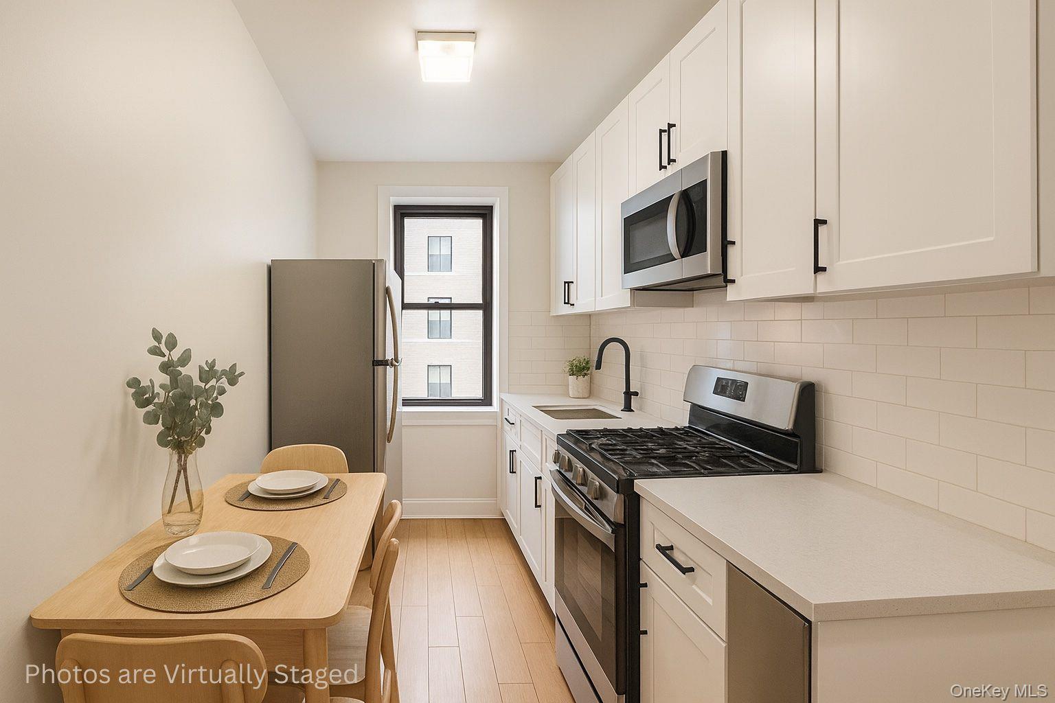 225 Bennett Avenue, Unit 2R Manhattan, NY 10040 - Photo 17 of 25 a kitchen with a appliances a sink and a stove