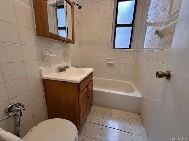 a bathroom with a sink a toilet and bathtub