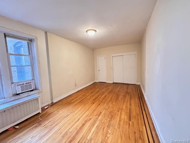 225 Bennett Avenue, Unit 2R Manhattan, NY 10040 - Photo 9 of 25 a view of empty room with wooden floor