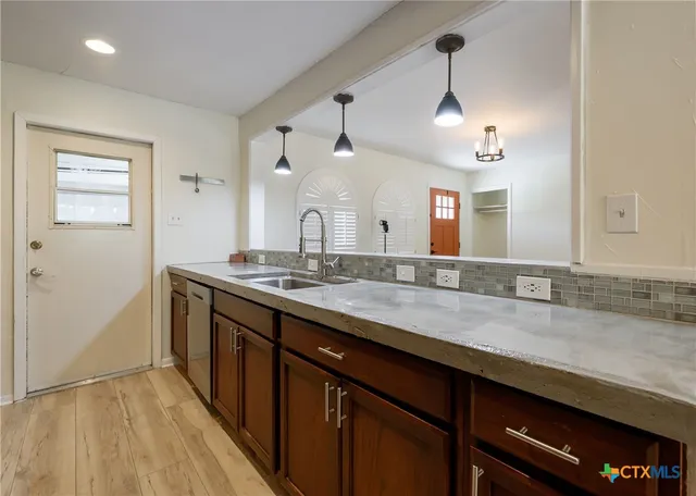 a bathroom with a sink and a mirror