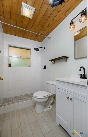 a bathroom with a toilet and a sink