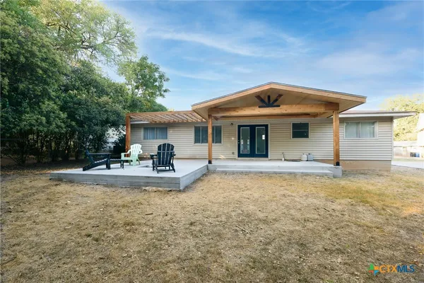 a front view of a house with swimming pool