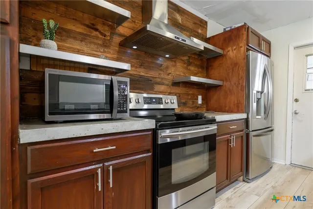 a kitchen with a stove and a microwave