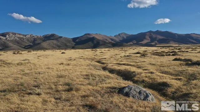 a view of ocean and mountain