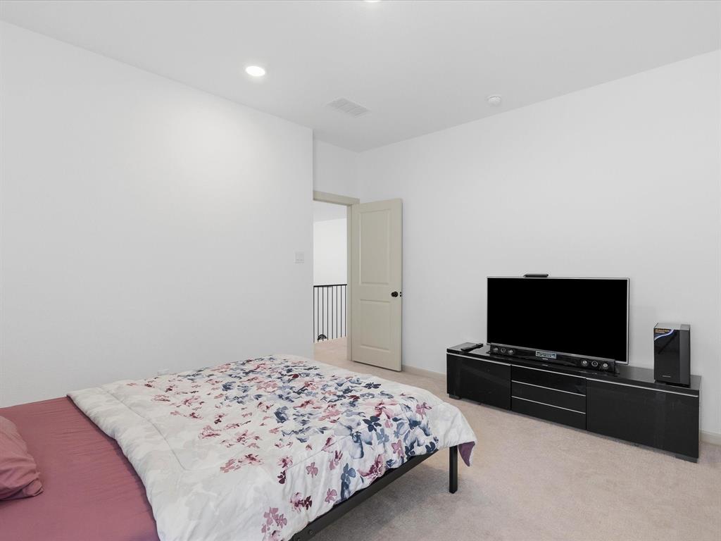 9533 Keep Street Frisco, TX 75035 - Photo 30 of 40 Room with light-colored carpeting and white wall finishes