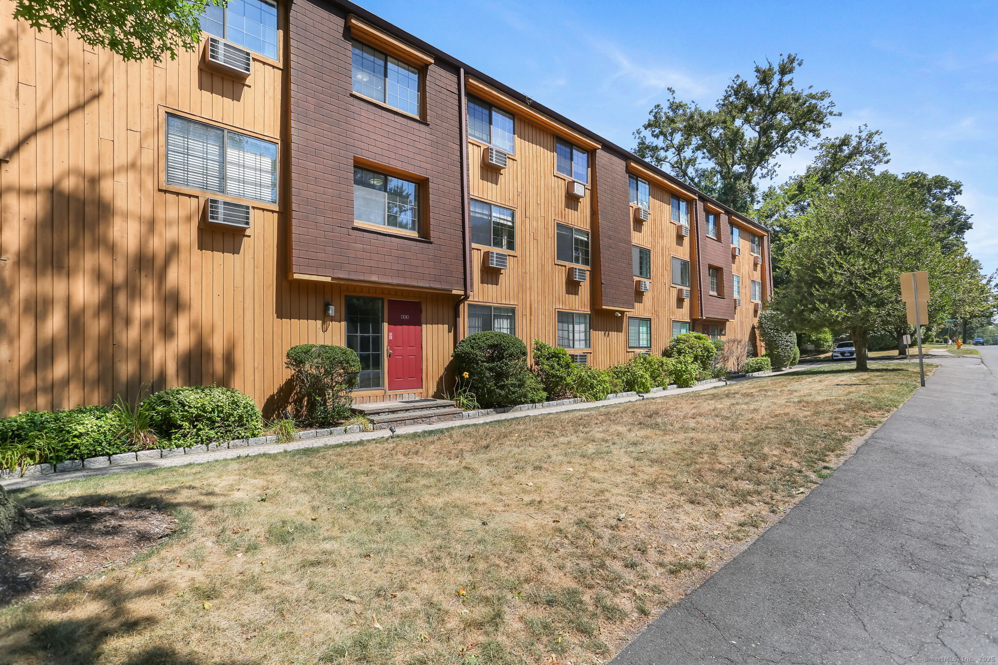 197 Bridge Street, Unit 9 Stamford, CT 06905 - Photo 1 of 1 a front view of a building with street view