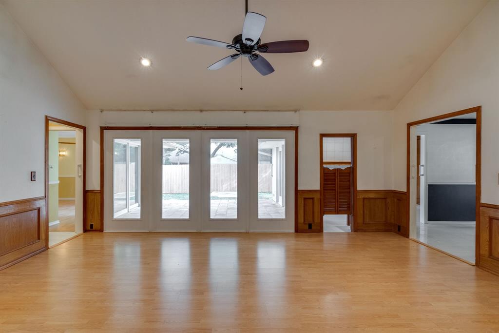 a view of an entryway with wooden floor
