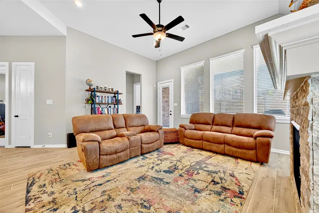 a living room with furniture and a large window
