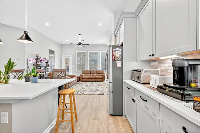 a kitchen with stove and cabinets