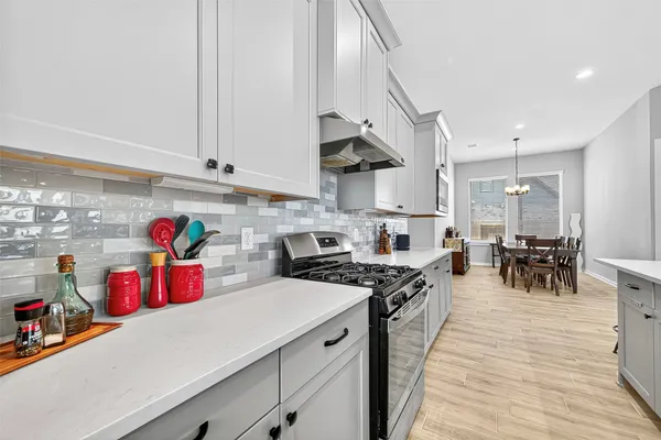 a kitchen with lots of counter top space and cabinets