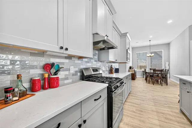a kitchen with lots of counter top space and cabinets