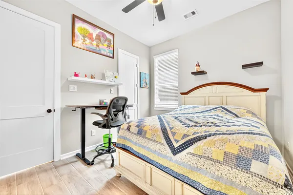 a bedroom with a bed and a table