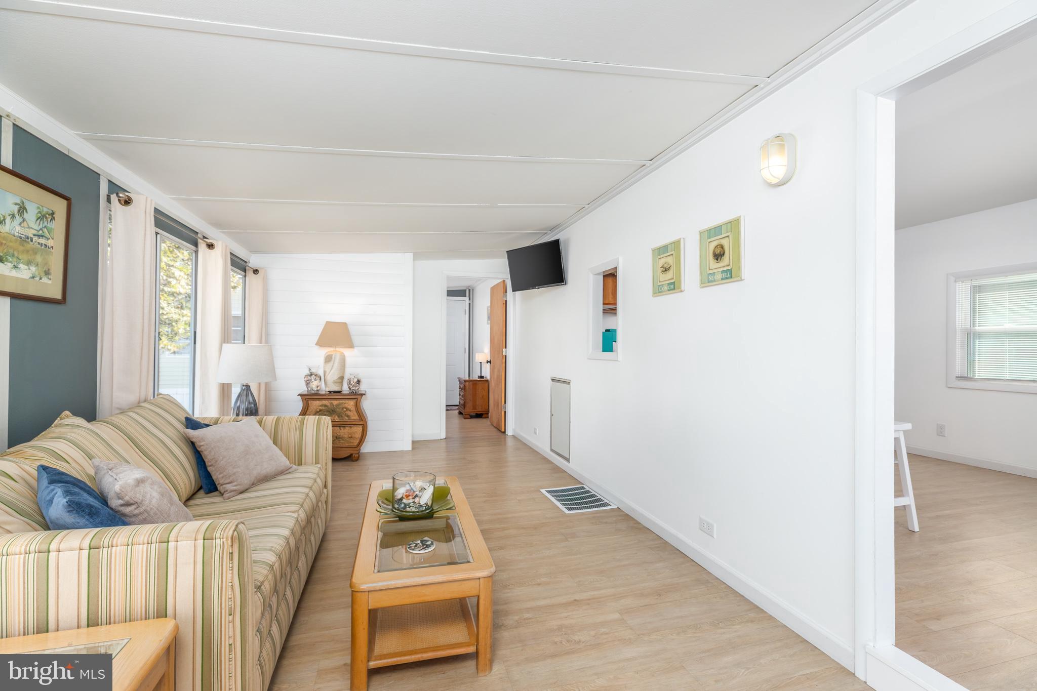 380 Seahawk Lane Berlin, MD 21811 - Photo 20 of 72 a living room with furniture and a rug