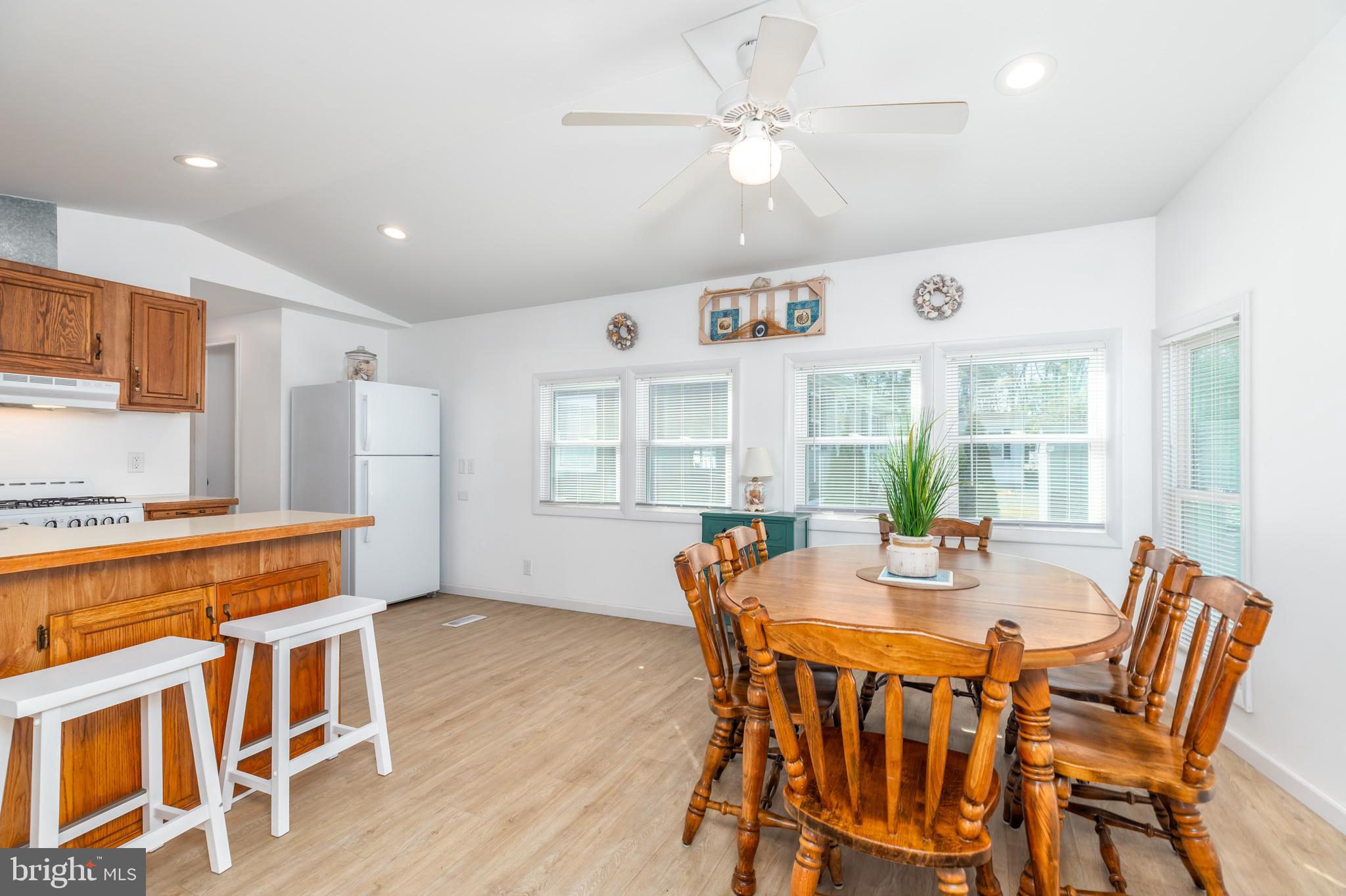380 Seahawk Lane Berlin, MD 21811 - Photo 21 of 72 a view of a dining room with furniture window and wooden floor