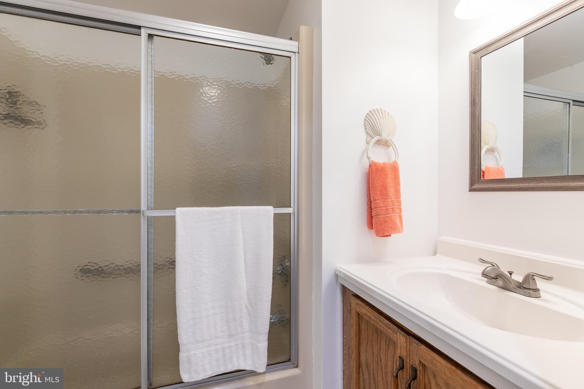 380 Seahawk Lane Berlin, MD 21811 - Photo 27 of 72 a bathroom with a sink vanity and a mirror