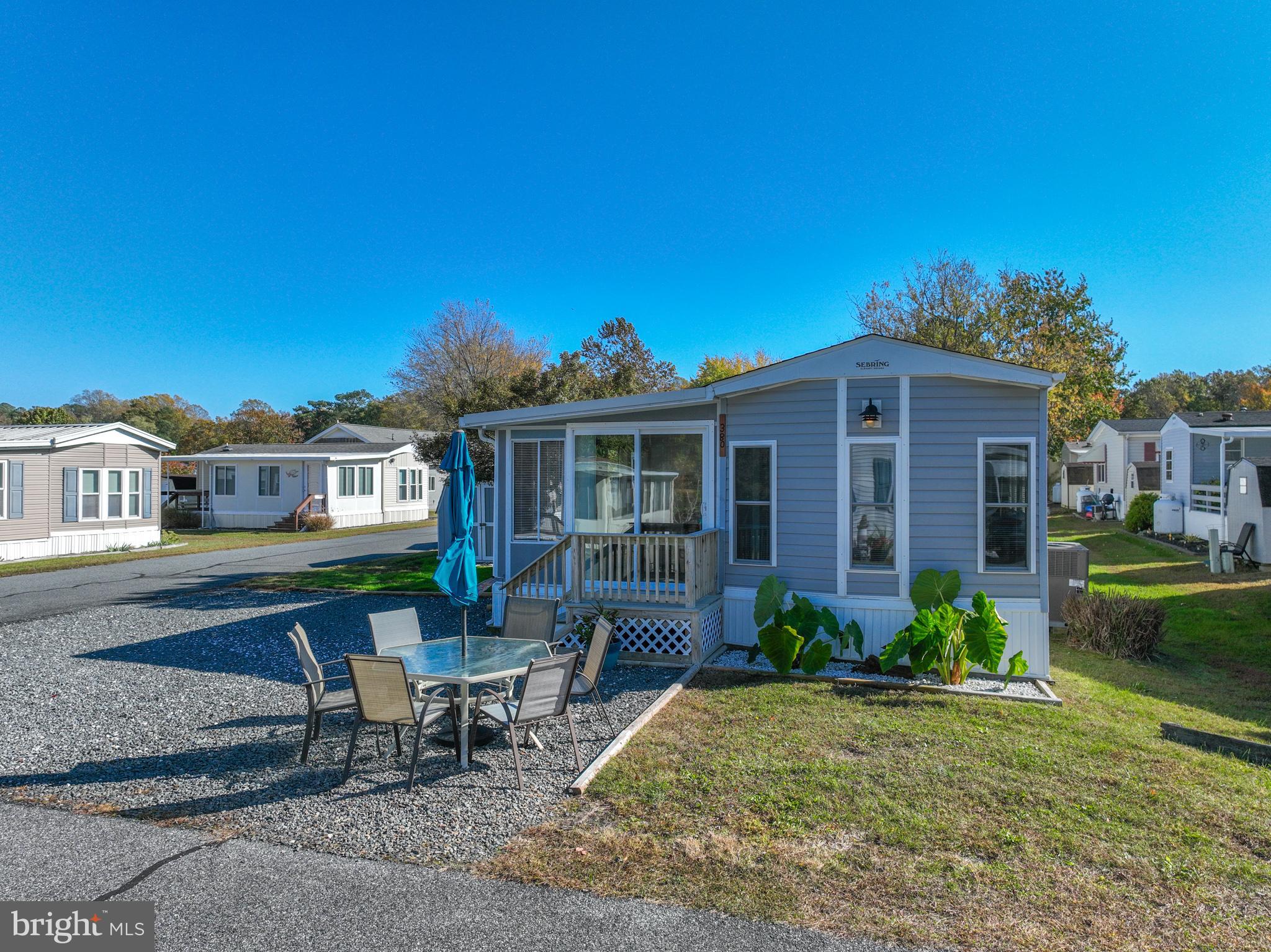 380 Seahawk Lane Berlin, MD 21811 - Photo 4 of 72 a front view of a house with garden and porch