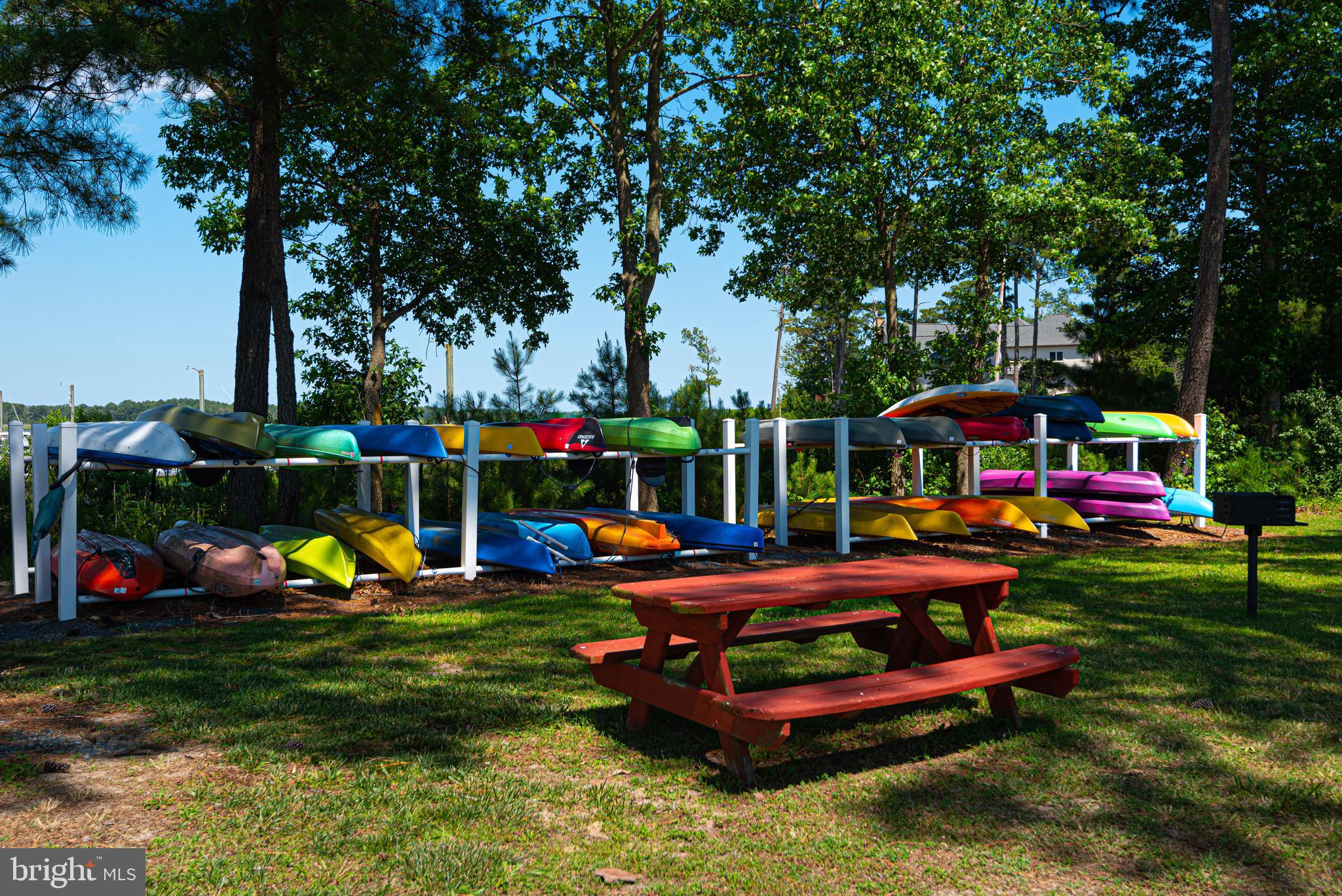 380 Seahawk Lane Berlin, MD 21811 - Photo 41 of 72 a childrens park with lots of swings and slides and swimming pool in the back