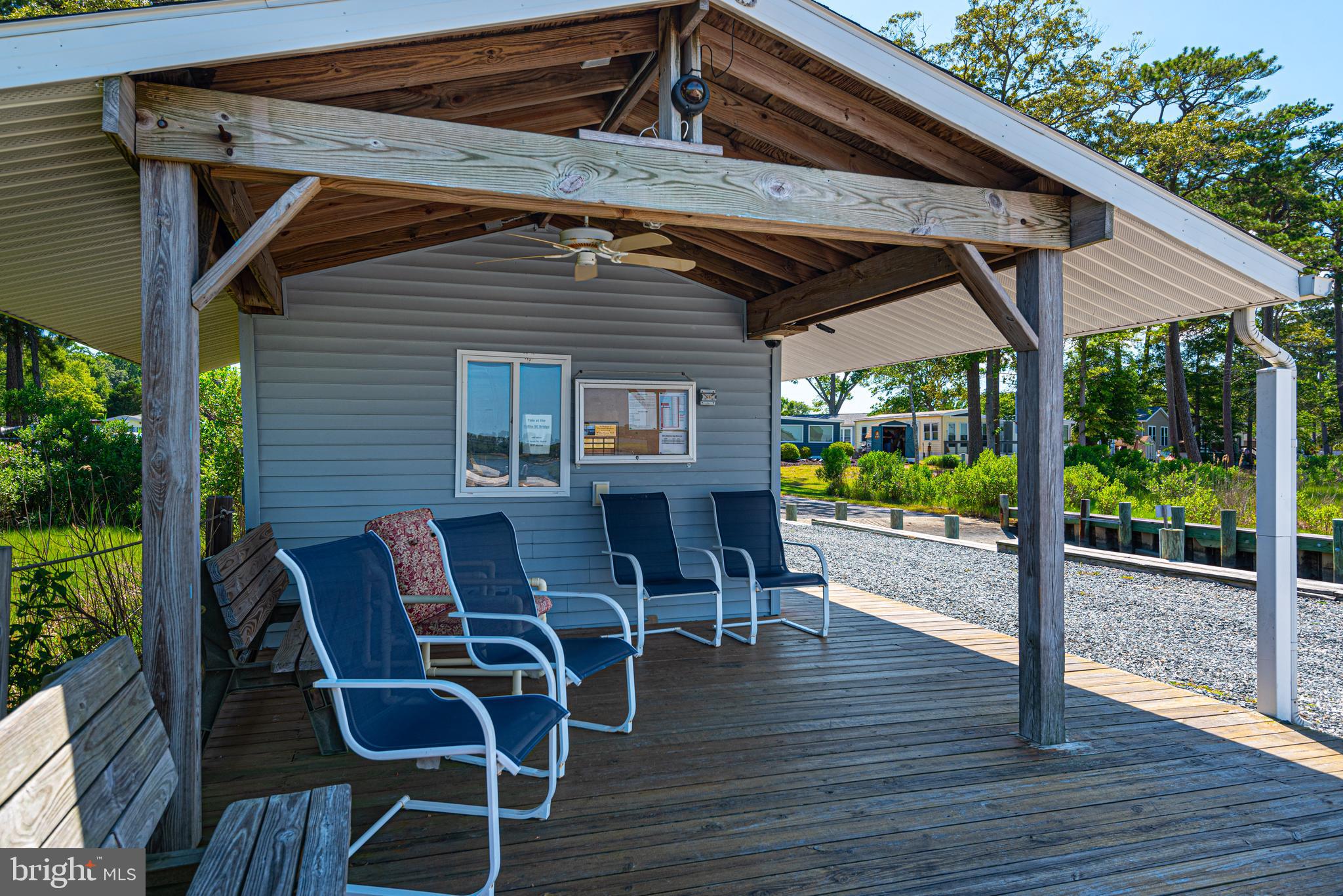 380 Seahawk Lane Berlin, MD 21811 - Photo 46 of 72 a patio with wooden floors table and chairs