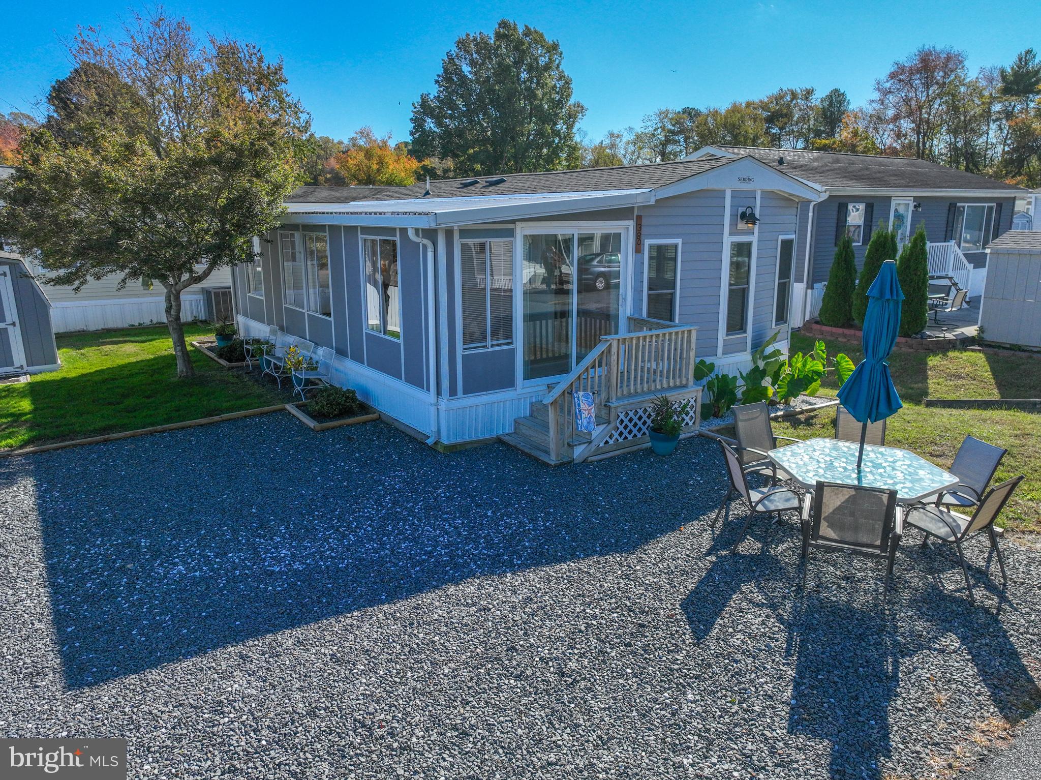 380 Seahawk Lane Berlin, MD 21811 - Photo 5 of 72 a view of a house with backyard sitting area and garden