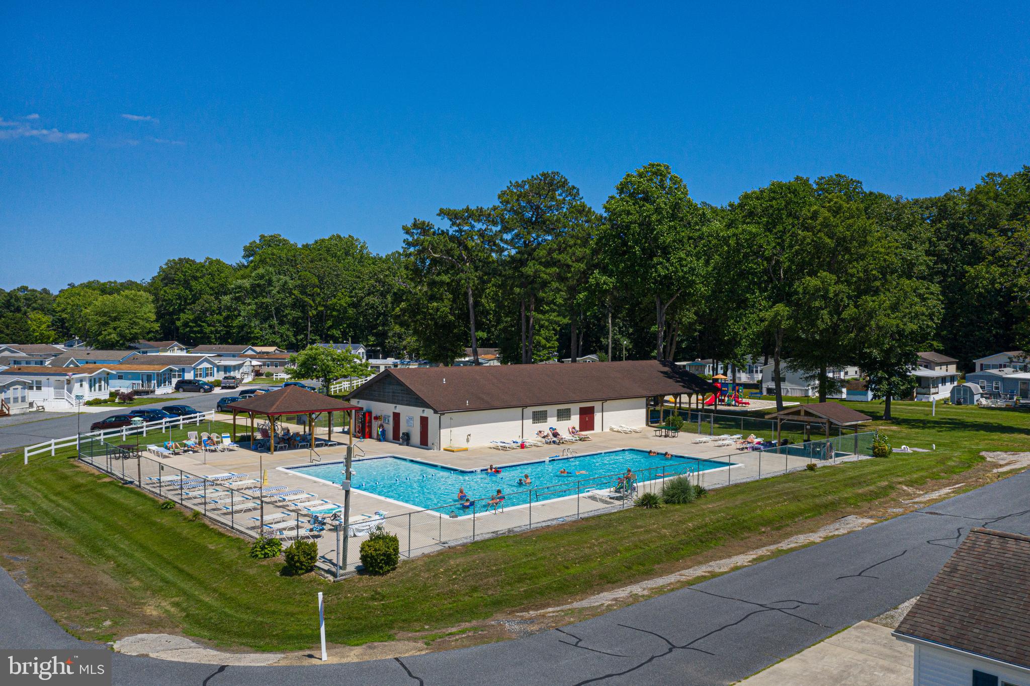 380 Seahawk Lane Berlin, MD 21811 - Photo 66 of 72 a view of a house with swimming pool and sitting area