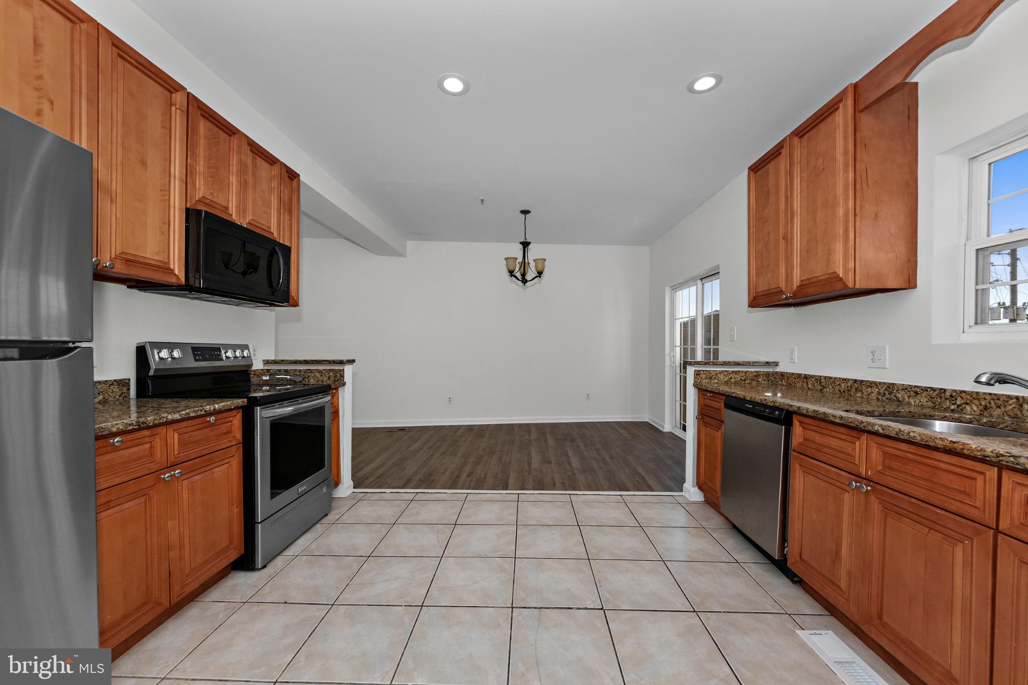2409 Bryan Place Southeast Washington, DC 20020 - Photo 24 of 43 Modern kitchen with warm wood accents.