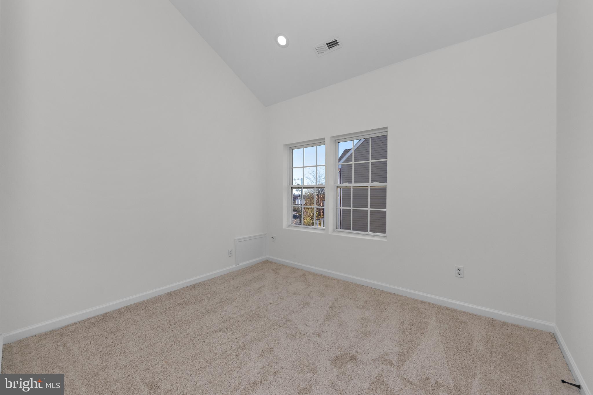 2409 Bryan Place Southeast Washington, DC 20020 - Photo 32 of 43 Bright and airy room with vaulted ceilings.