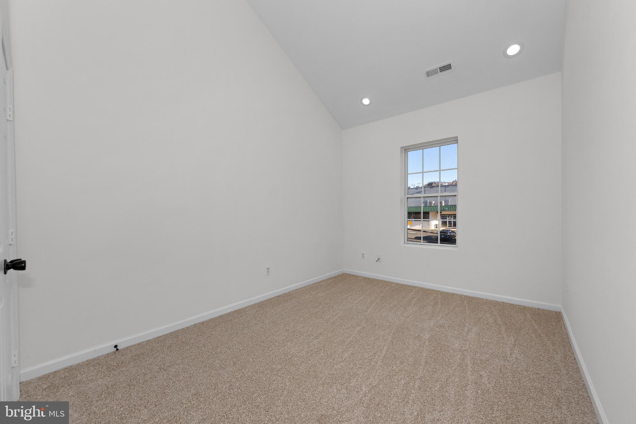 2409 Bryan Place Southeast Washington, DC 20020 - Photo 35 of 43 Bright and airy room with vaulted ceilings.