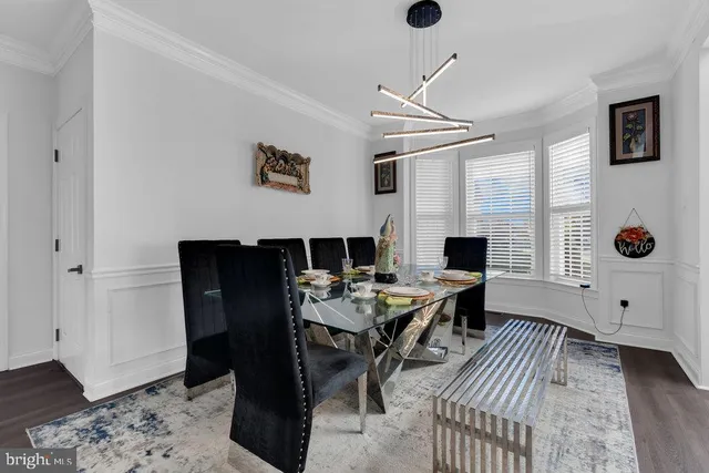 a view of a workspace with furniture and wooden floor