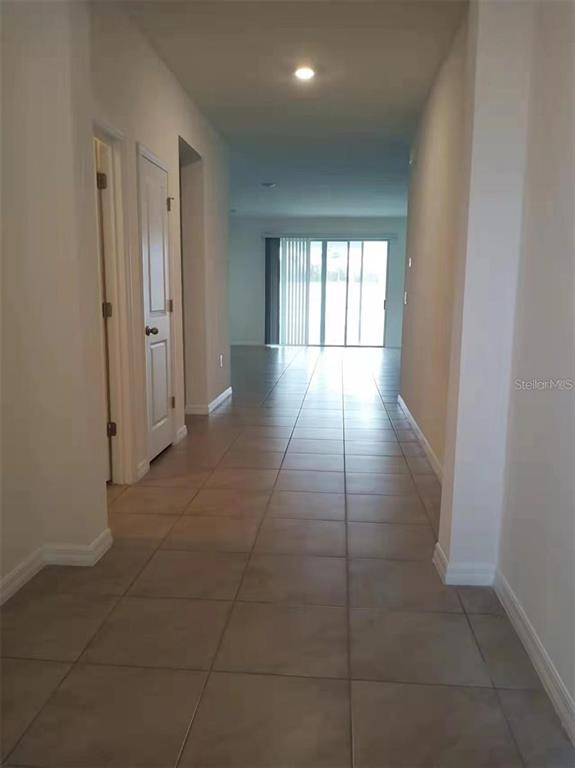 13372 Golden Lime Ave Spring Hill Spring Hill, FL 34609 - Photo 16 of 18 a view of hallway with windows