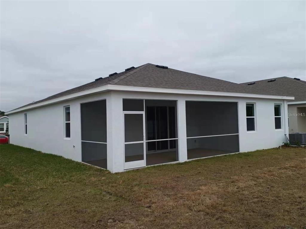 13372 Golden Lime Ave Spring Hill Spring Hill, FL 34609 - Photo 2 of 18 a house with yard in front of it