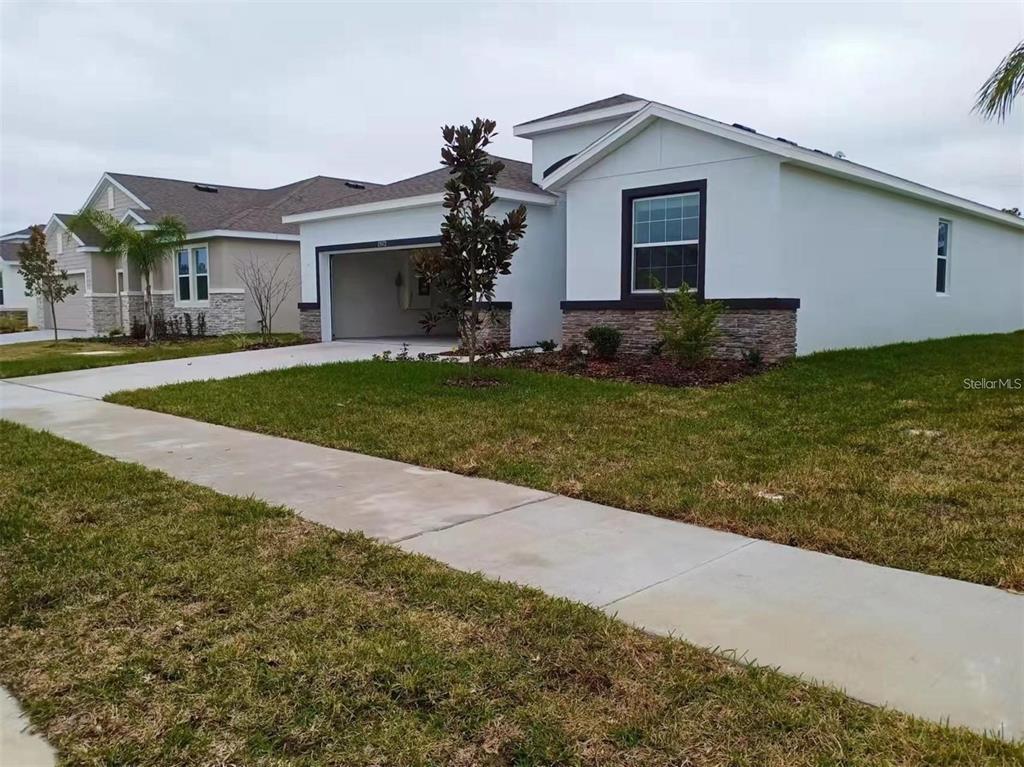 13372 Golden Lime Ave Spring Hill Spring Hill, FL 34609 - Photo 3 of 18 a front view of house with yard and green space