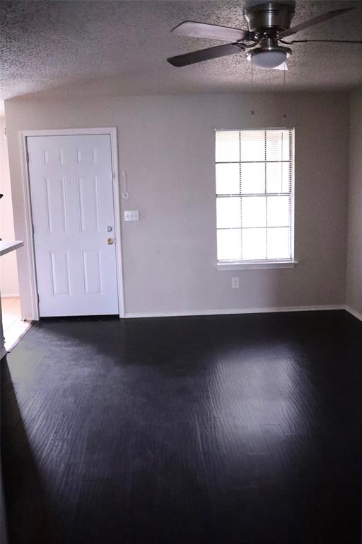a view of room with hardwood floor and window
