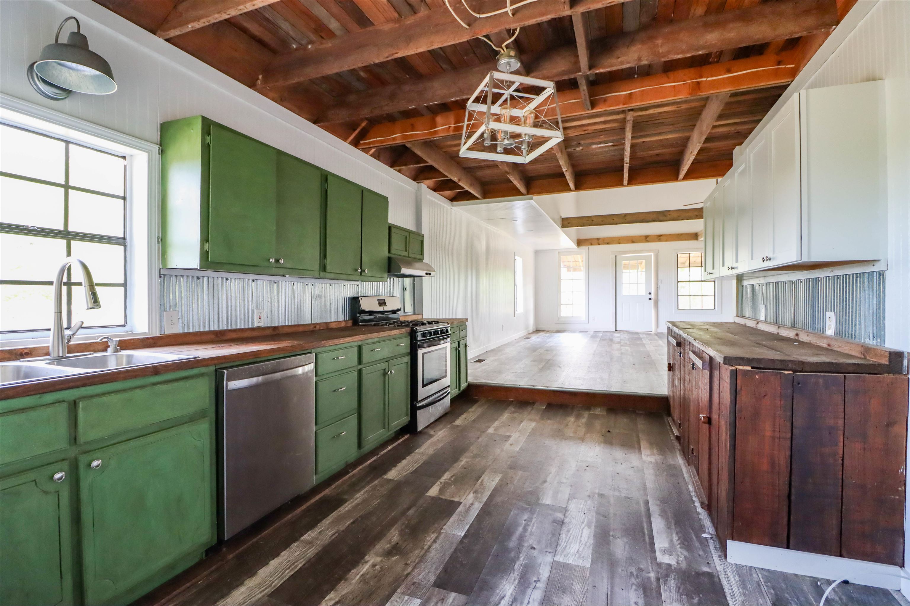 283 Forked Deer Road Ripley, TN 38063 - Photo 11 of 23 a kitchen with a sink and wooden floors