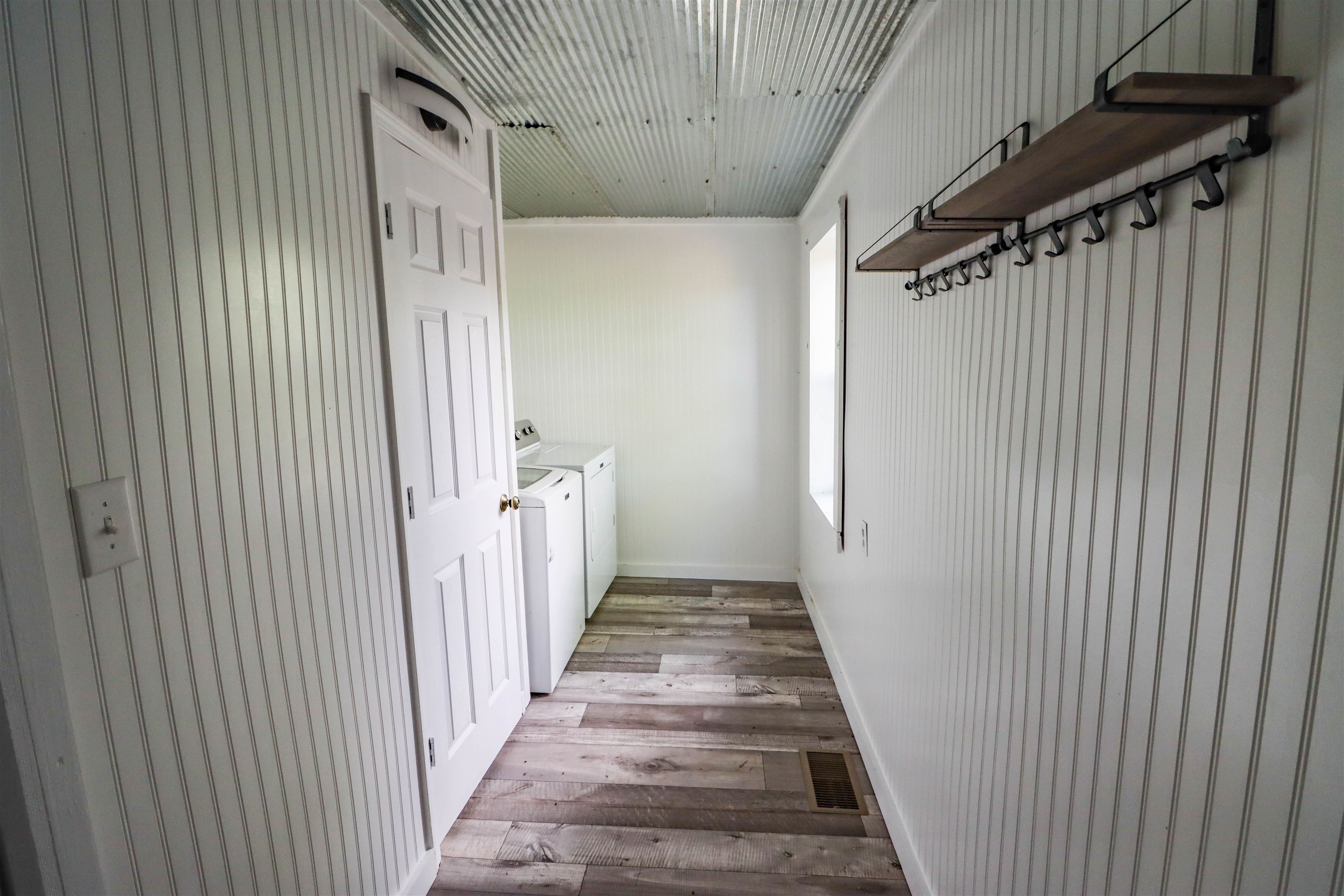 283 Forked Deer Road Ripley, TN 38063 - Photo 13 of 23 a view of a hallway with wooden floor and staircase