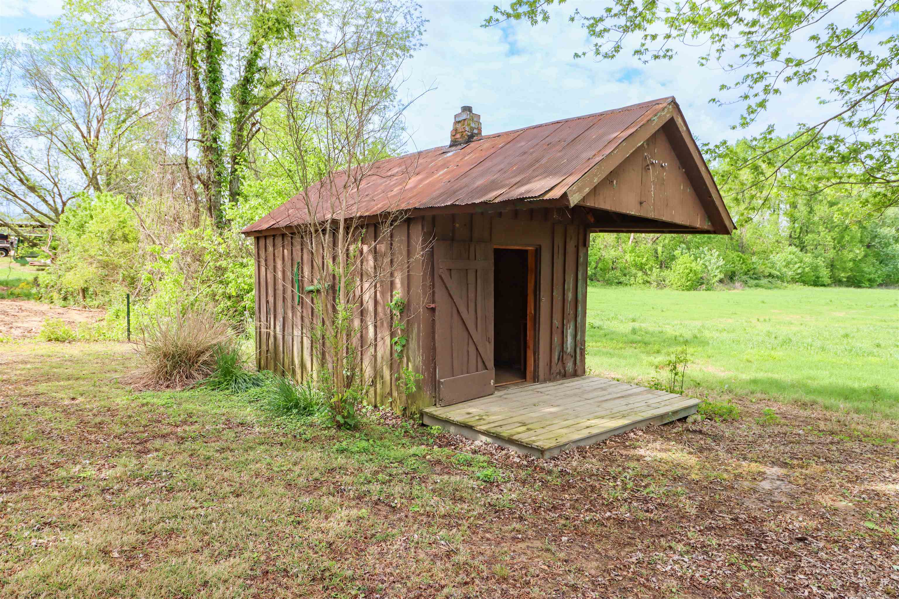 283 Forked Deer Road Ripley, TN 38063 - Photo 22 of 23 a view of wooden house with a yard