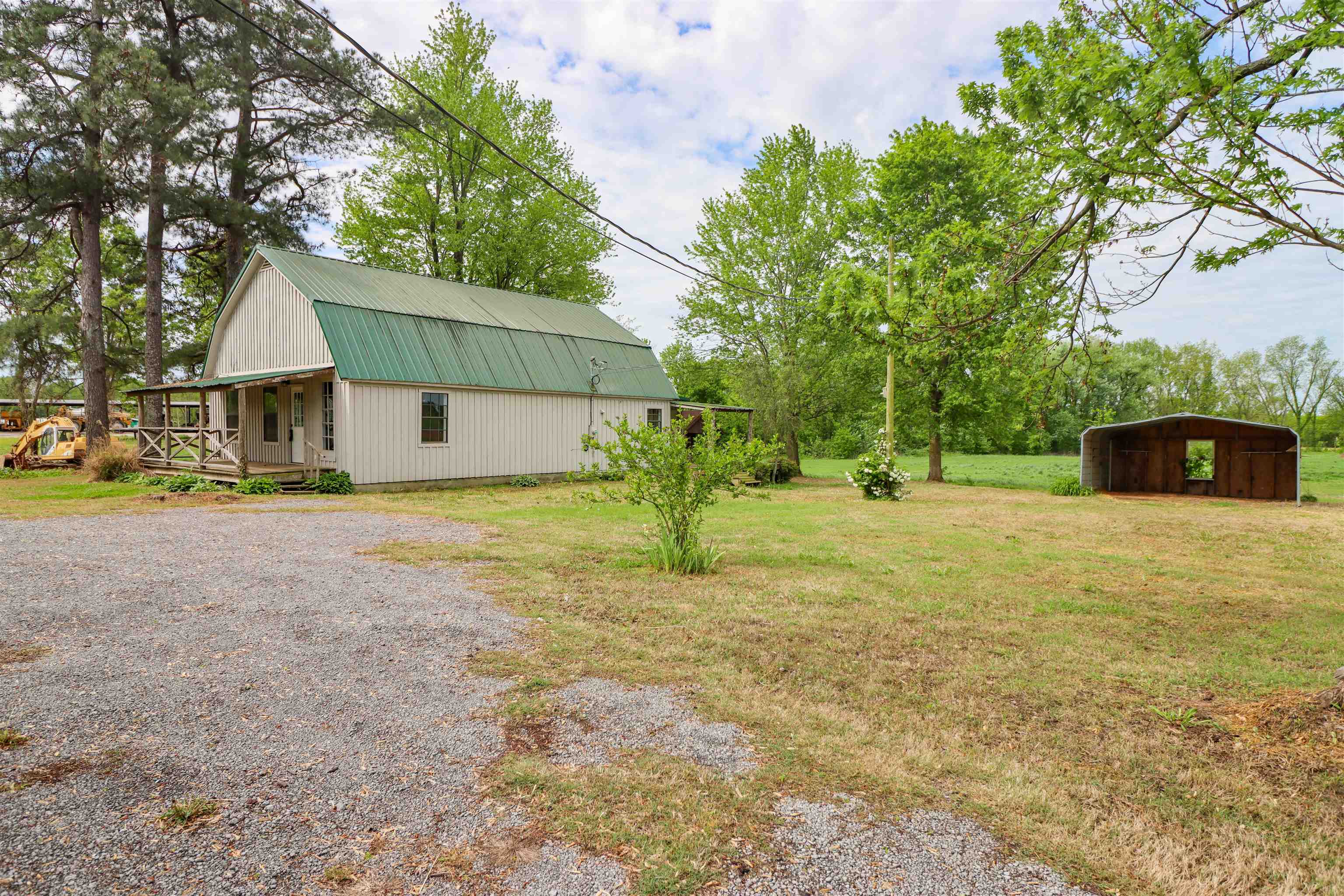 283 Forked Deer Road Ripley, TN 38063 - Photo 23 of 23 a front view of a house with a yard and trees