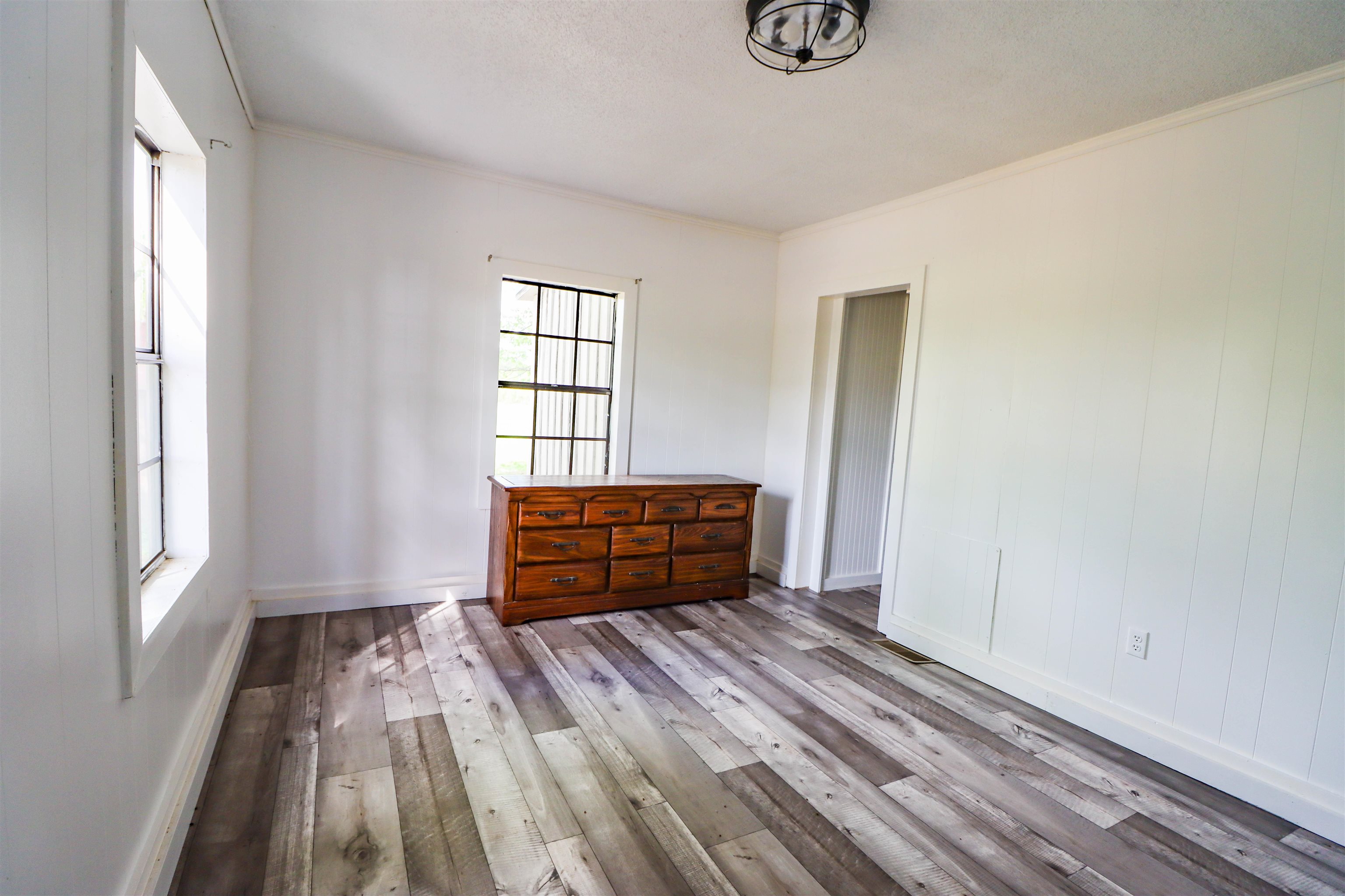 283 Forked Deer Road Ripley, TN 38063 - Photo 6 of 23 a room with a window and a wooden floor