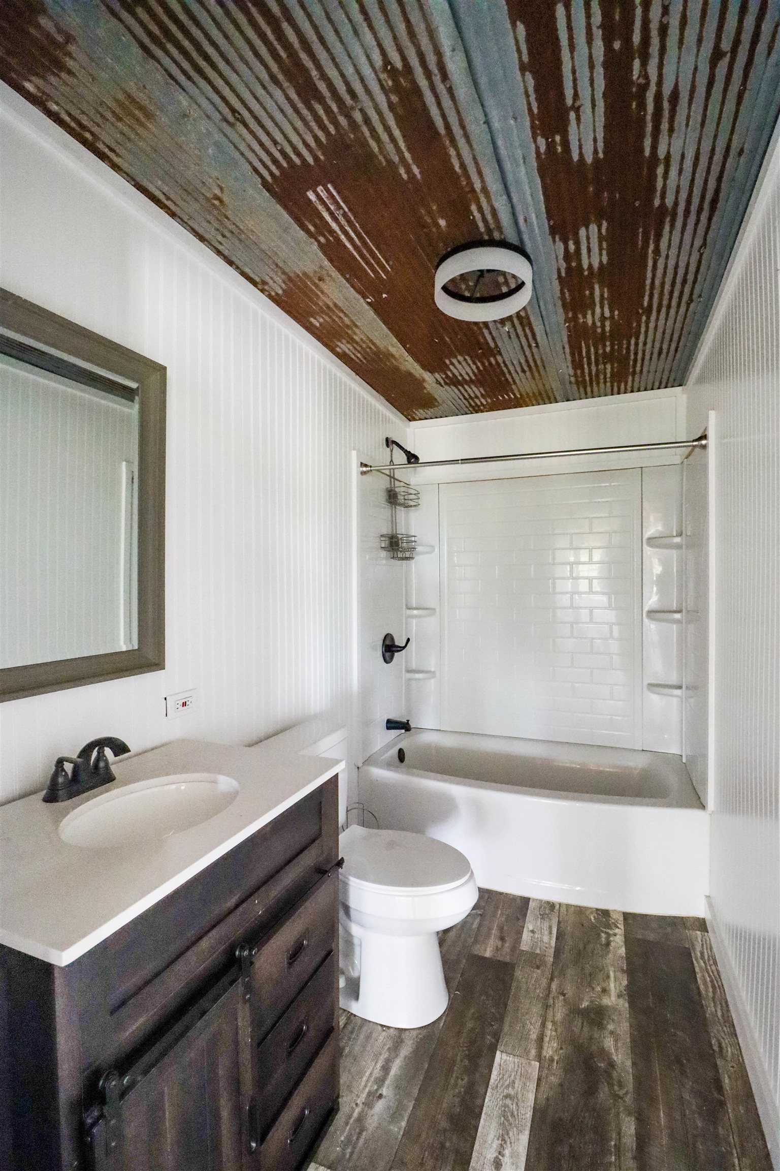 283 Forked Deer Road Ripley, TN 38063 - Photo 8 of 23 a bathroom with a sink a toilet a mirror and bathtub