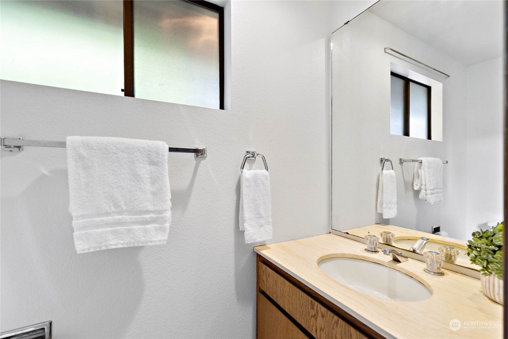 40 Chelan Key Bellevue, WA 98006 - Photo 11 of 29 a bathroom with a sink vanity and a mirror