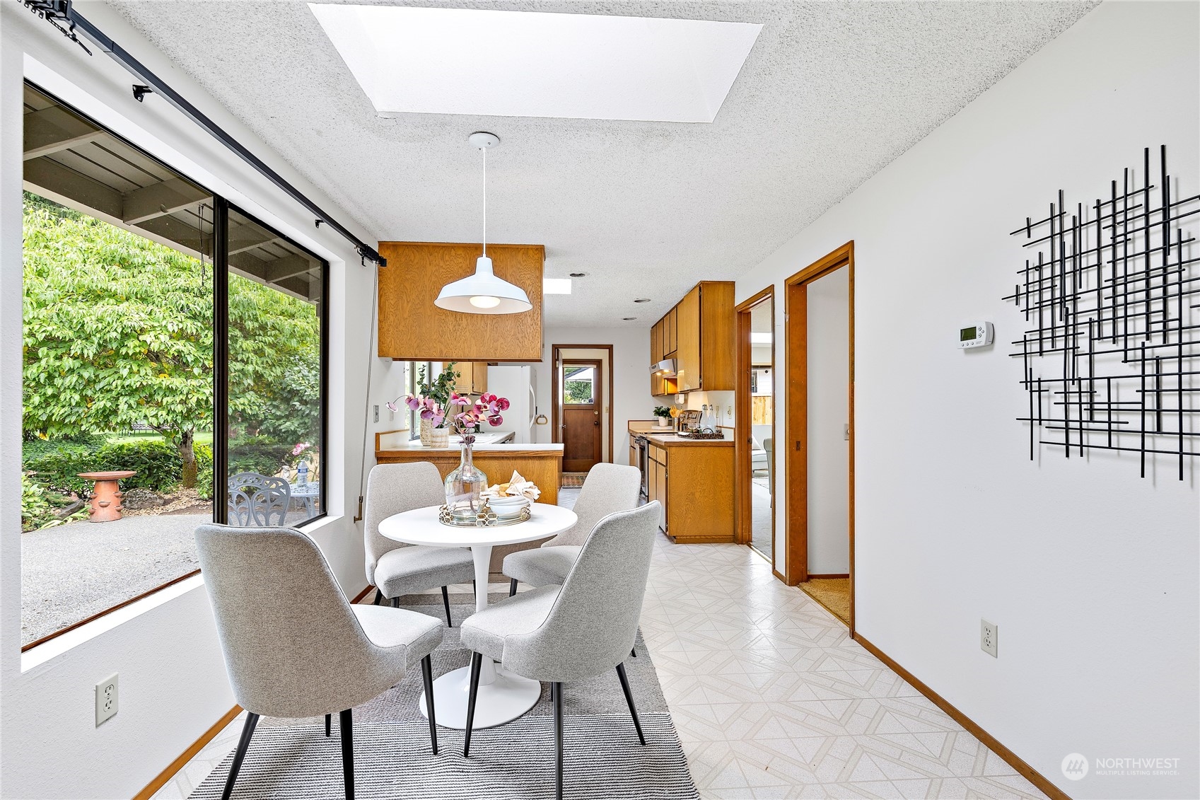 40 Chelan Key Bellevue, WA 98006 - Photo 13 of 29 a dining room with furniture and a large window