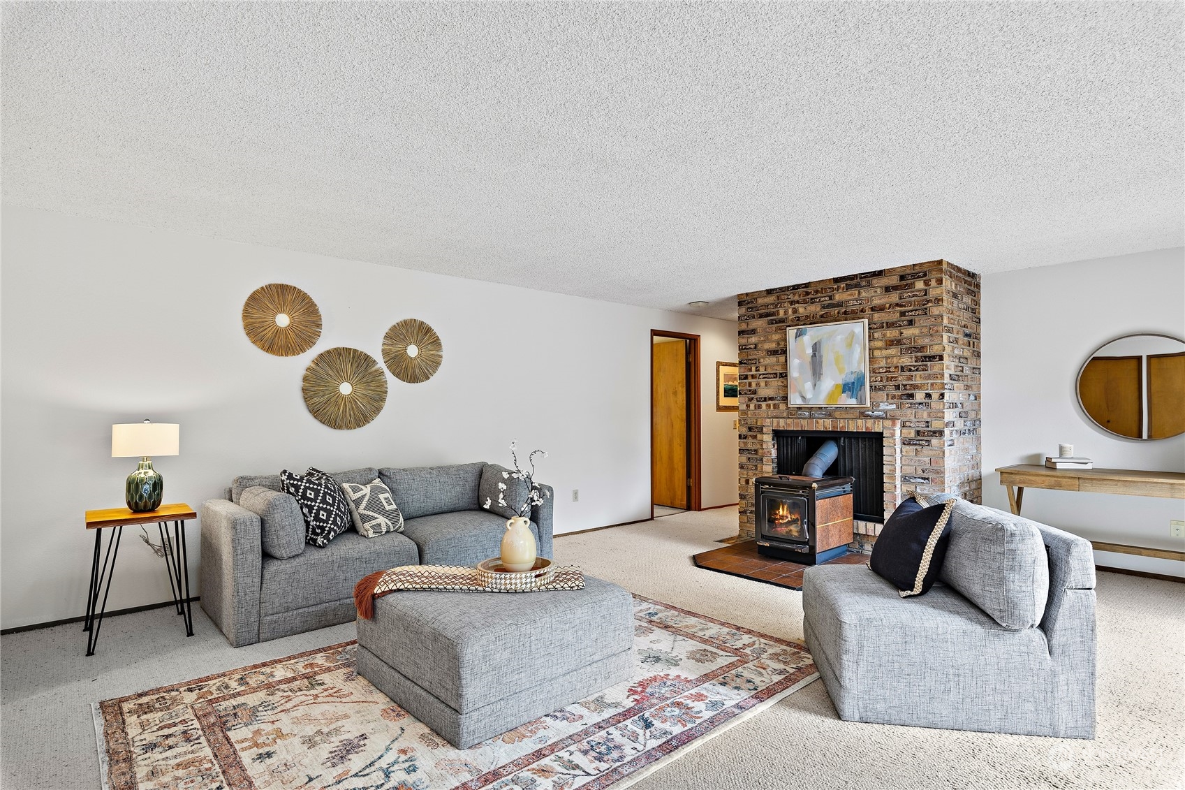 40 Chelan Key Bellevue, WA 98006 - Photo 14 of 29 a living room with furniture and a fireplace