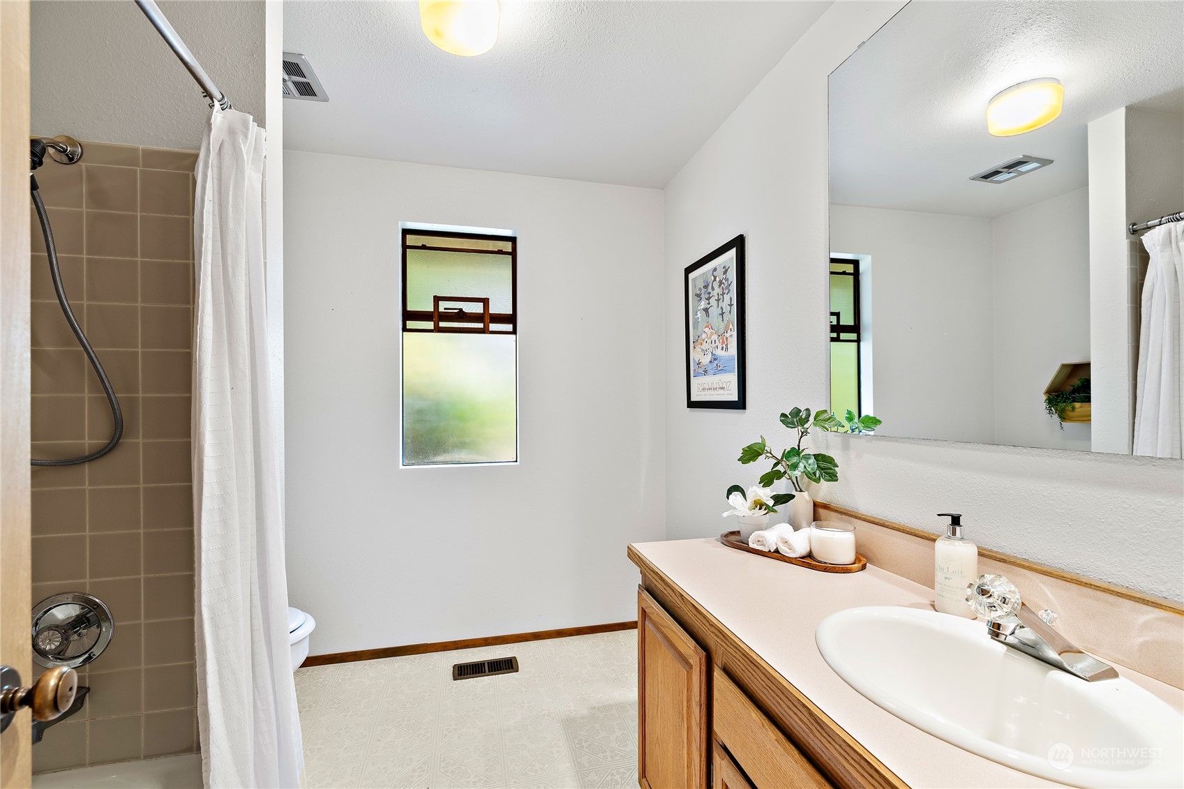 40 Chelan Key Bellevue, WA 98006 - Photo 26 of 29 a bathroom with a sink vanity and a mirror