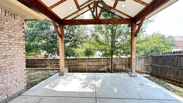 a view of outdoor space with wooden fence