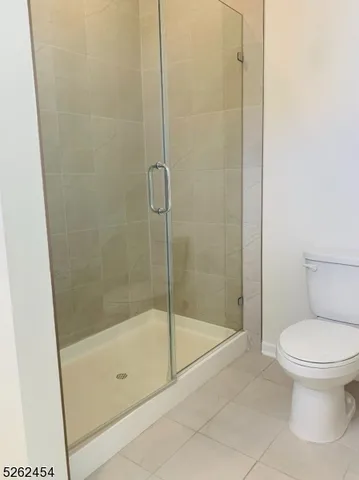 a bathroom with a shower and a toilet